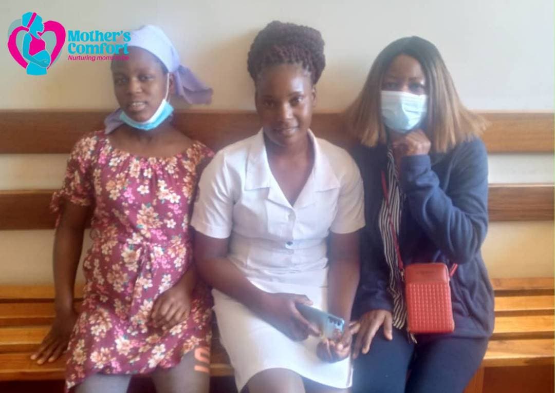 Mother's Comfort team supporting a mother at a clinic
